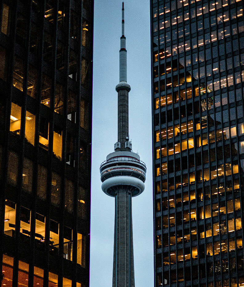 A sleek, modern hallway with transparent glass wall sand a warm wooden floor symbolizing transparency and relational approach